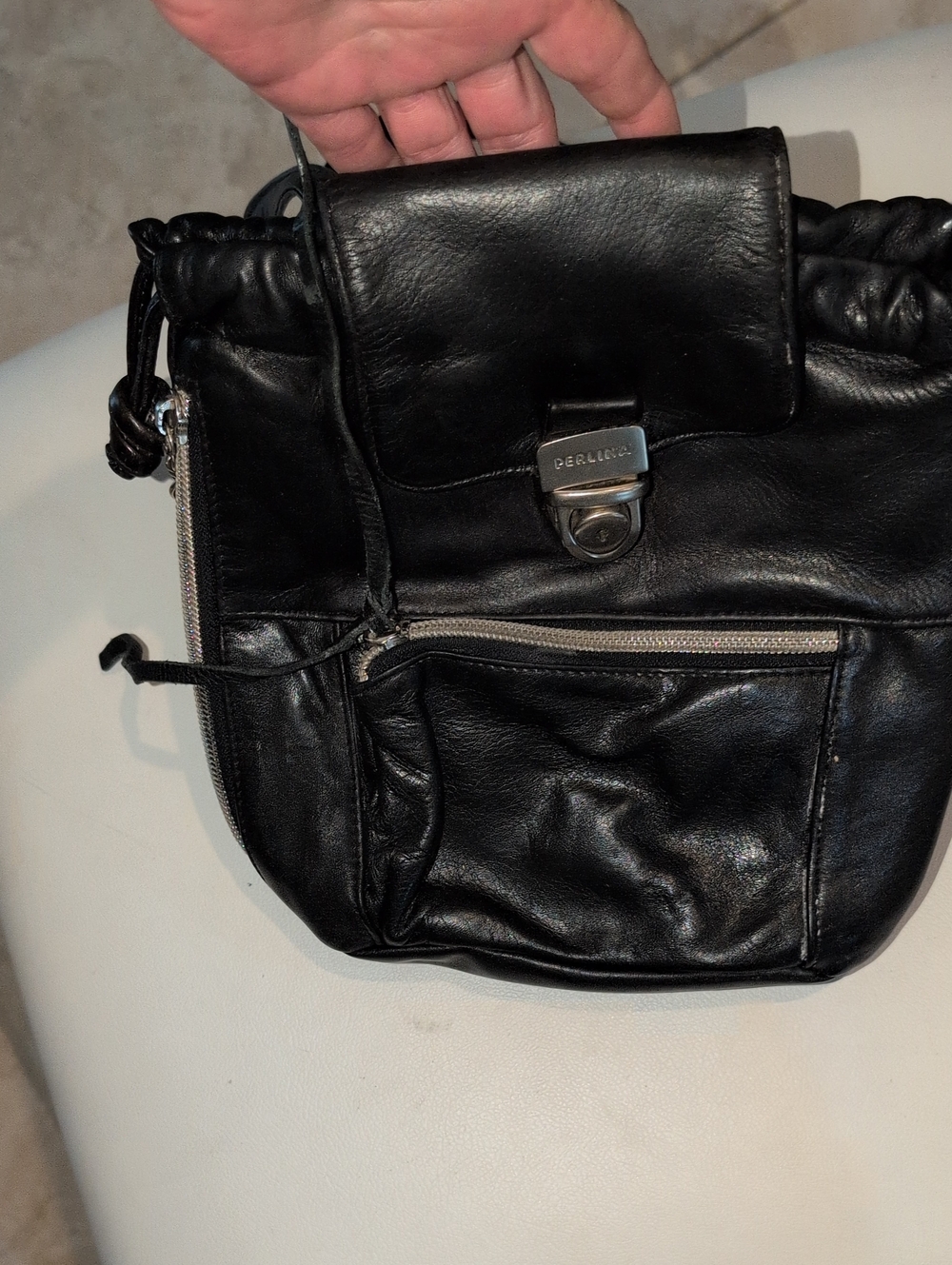 Perlina Black Leather Drawstring Crossbody with Front Zip